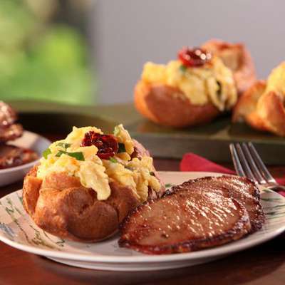 Black Pepper Popovers filled with Vermont Cheddar and Herb Scrambled Eggs and Maple-Mustard Glazed Canadian Bacon - RecipeNode.com