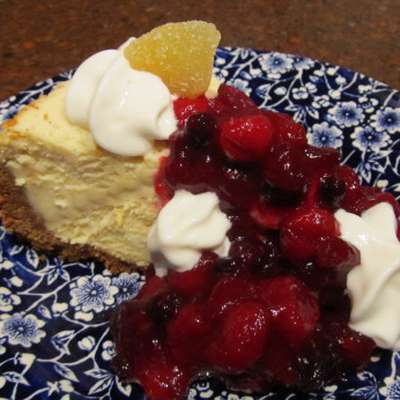 Festive Creamy Cheesecake With Tangy Cranberry Topping! - RecipeNode.com