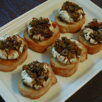 Marinated Goat Cheese Rounds With Crostini - RecipeNode.com