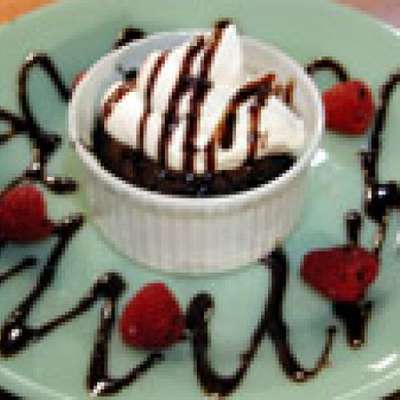 Molten Chocolate Cakes with Raspberries and Cream - RecipeNode.com