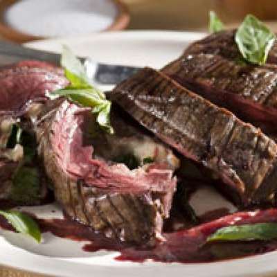 Red Wine Marinated Flank Steak Filled with Prosciutto, Fontina and Basil with Cabernet-Shallot Reduction - RecipeNode.com